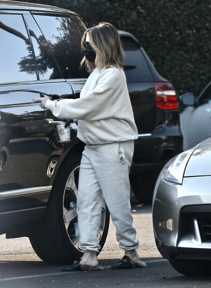 ashley tisdale opts for beige sweatsuit and black face mask on a coffee run in la 2