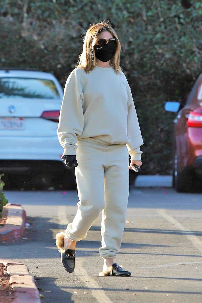 ashley tisdale opts for beige sweatsuit and black face mask on a coffee run in la 4