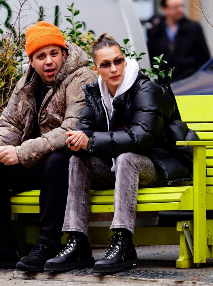 bella hadid in casual outfit on a park bench in new york city with a friend 1
