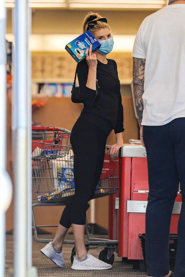 charlotte mckinney in a black outfit during a masked pharmacy run 1