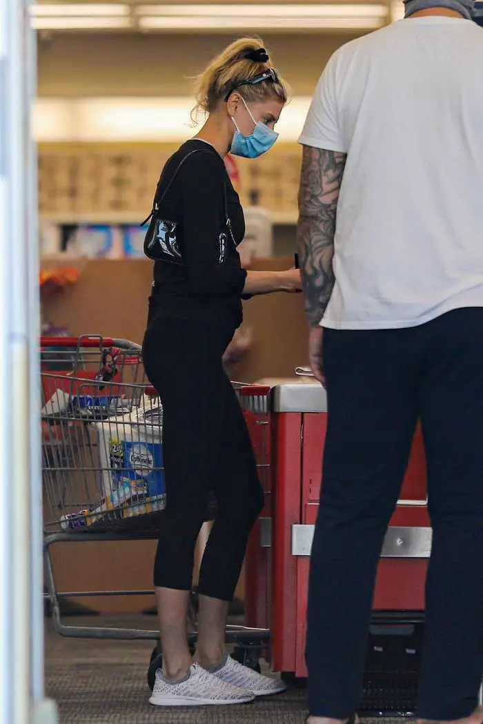 charlotte mckinney in a black outfit during a masked pharmacy run 2