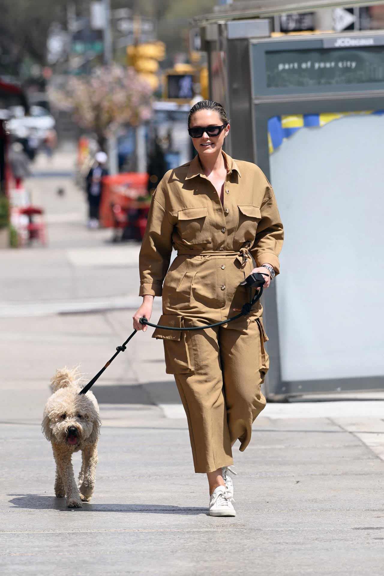 georgina burke takes her dog out for a morning stroll in ny 1