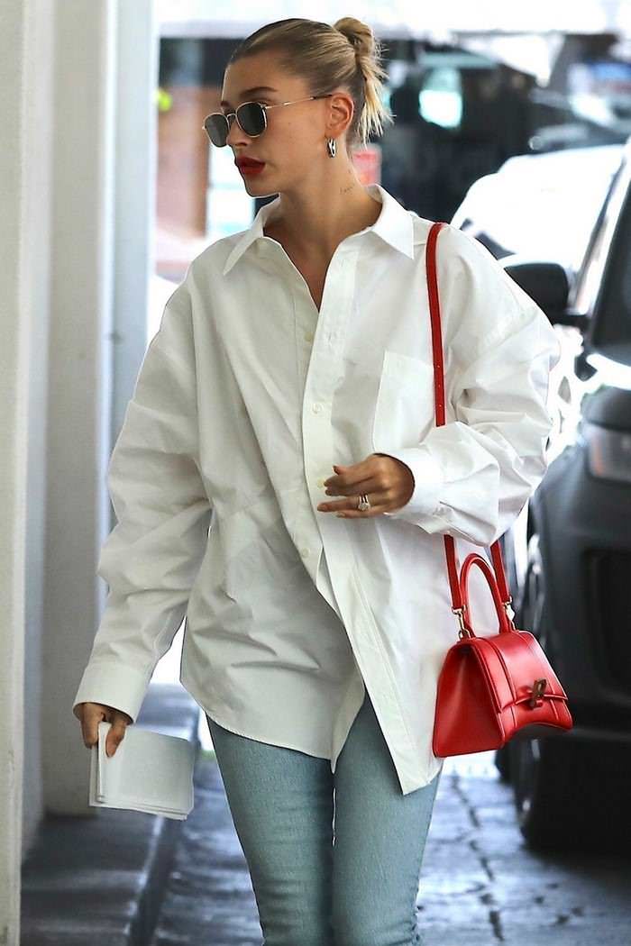 hailey rhode bieber in balenciaga white shirt khaite kyle blue jeans visiting a skincare clinic 3