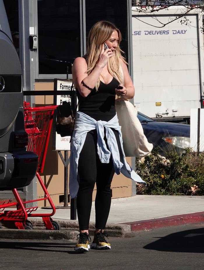 hilary duff kept it comfy and cute in a black jumpsuit in la 2