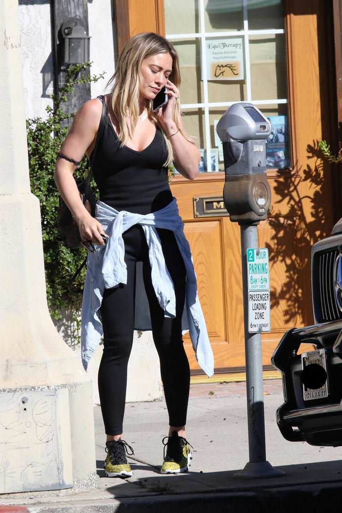 hilary duff kept it comfy and cute in a black jumpsuit in la 3