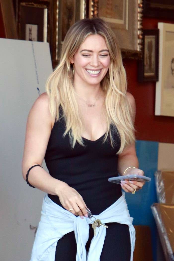 hilary duff kept it comfy and cute in a black jumpsuit in la 4