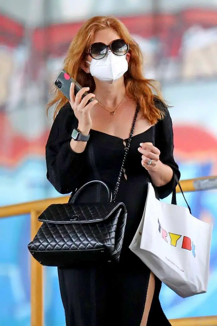 isla fisher in a slitted black dress enjoys shopping in sydney 2