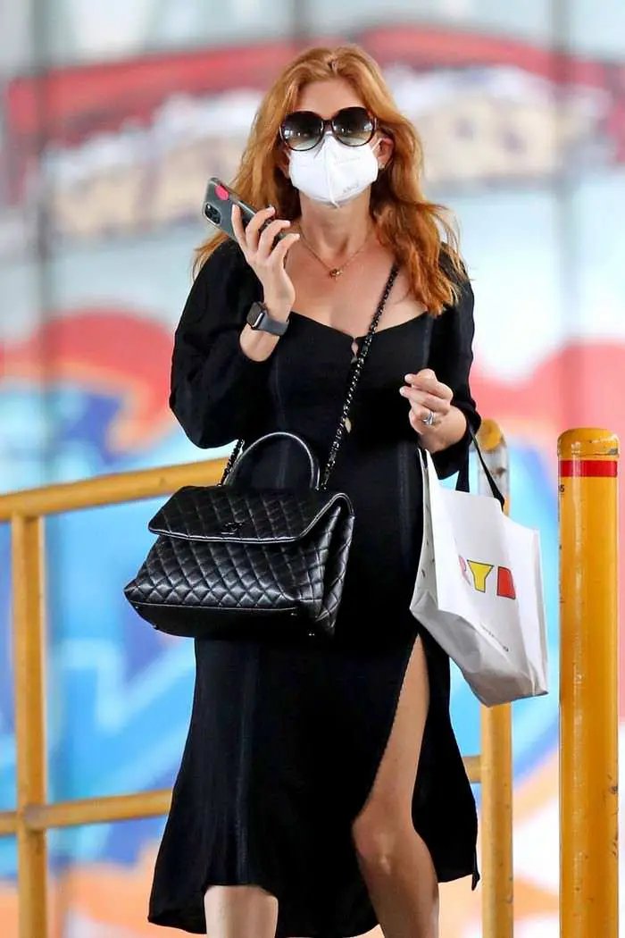 isla fisher in a slitted black dress enjoys shopping in sydney 3