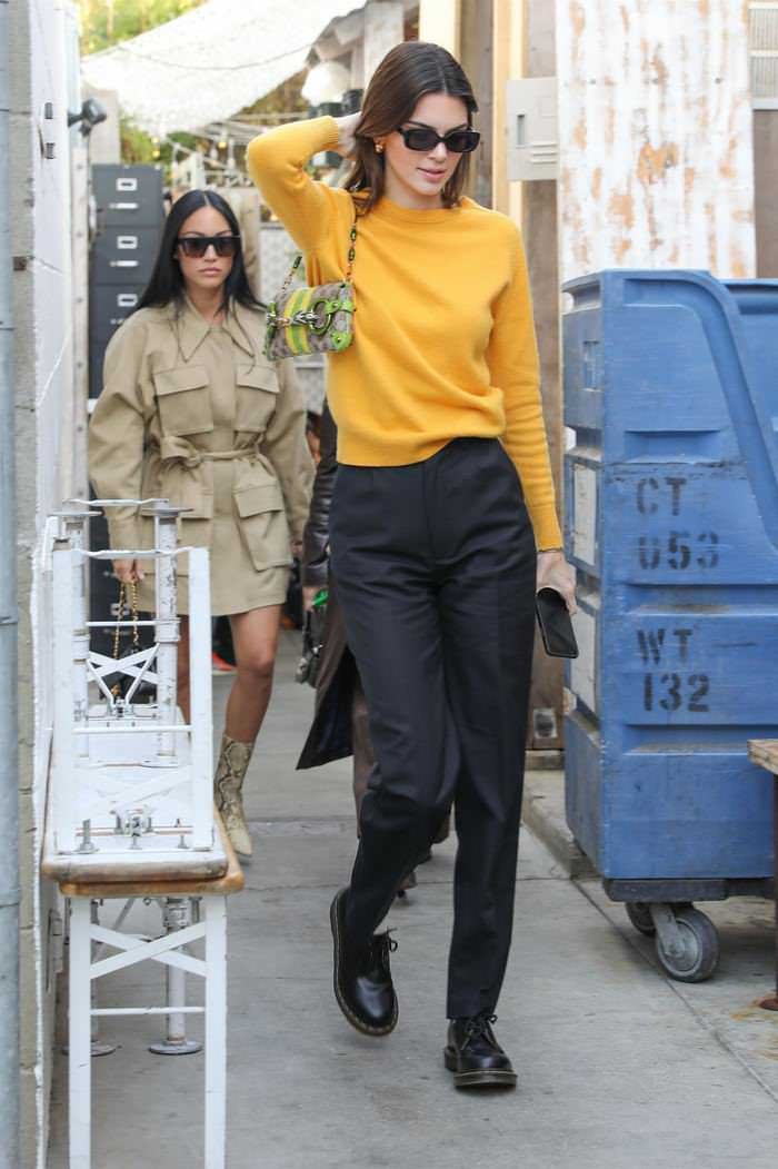 kendall jenner in a black pants yellow sweater out in venice 1