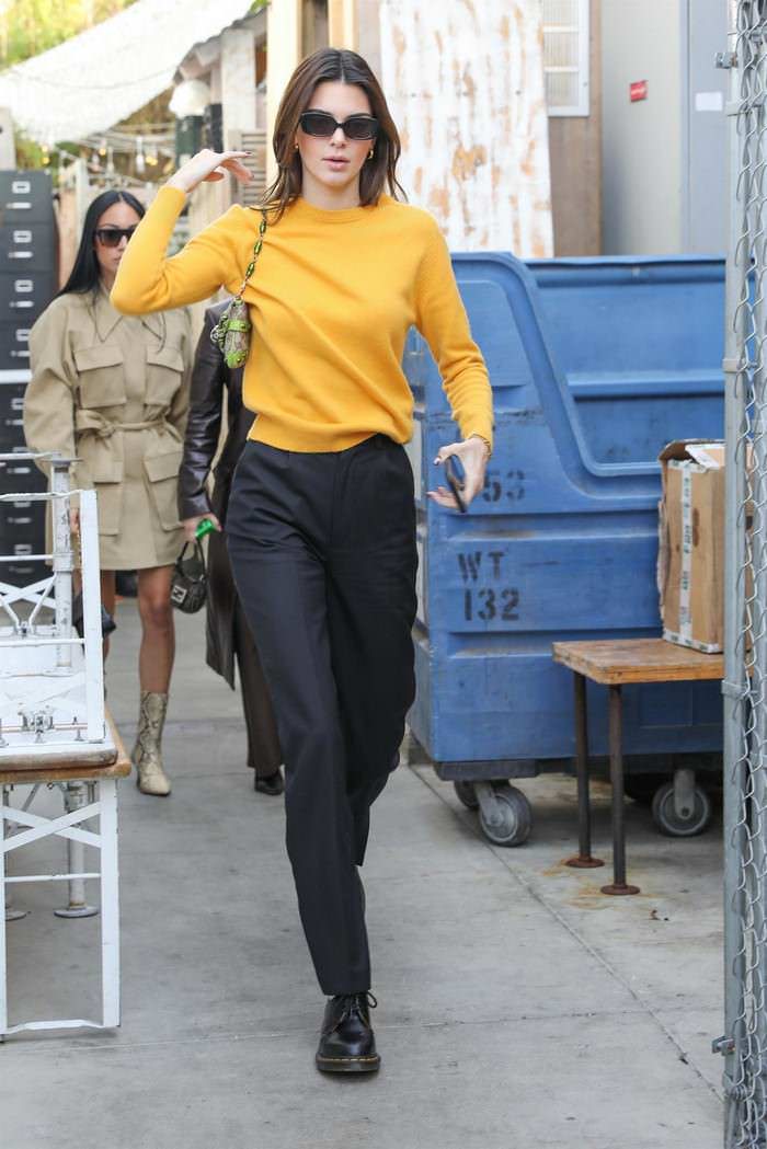 kendall jenner in a black pants yellow sweater out in venice 3