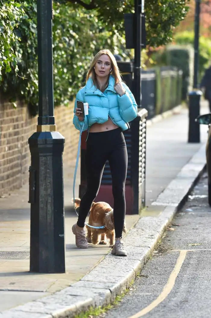kimberley garner flashes her abs and a black sports bra while walking her dog 4