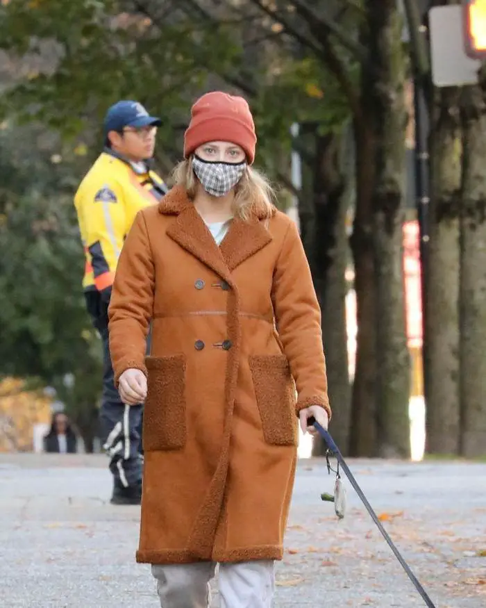 lili reinhart in the brown fleece lined coat takes her dog for a walk in vancouver 1
