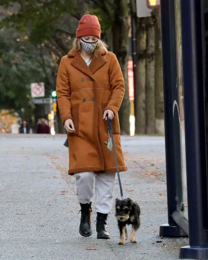 lili reinhart in the brown fleece lined coat takes her dog for a walk in vancouver 2