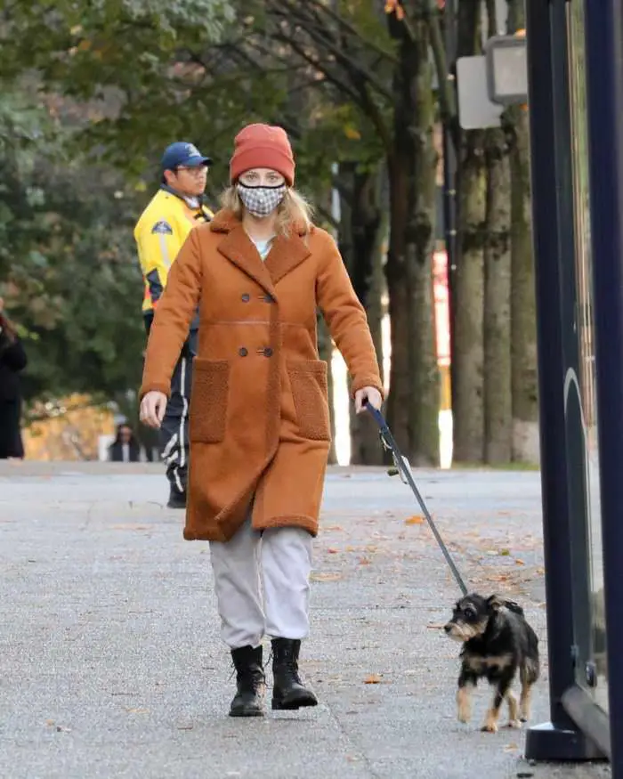 lili reinhart in the brown fleece lined coat takes her dog for a walk in vancouver 3