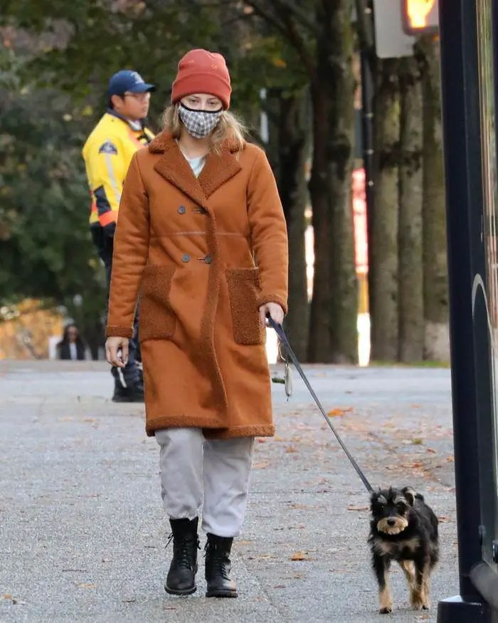lili reinhart in the brown fleece lined coat takes her dog for a walk in vancouver 4