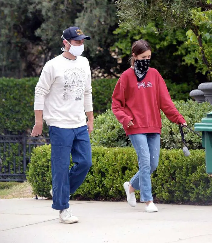 lily collins takes her dog out for a walk with bf charlie mcdowell 2