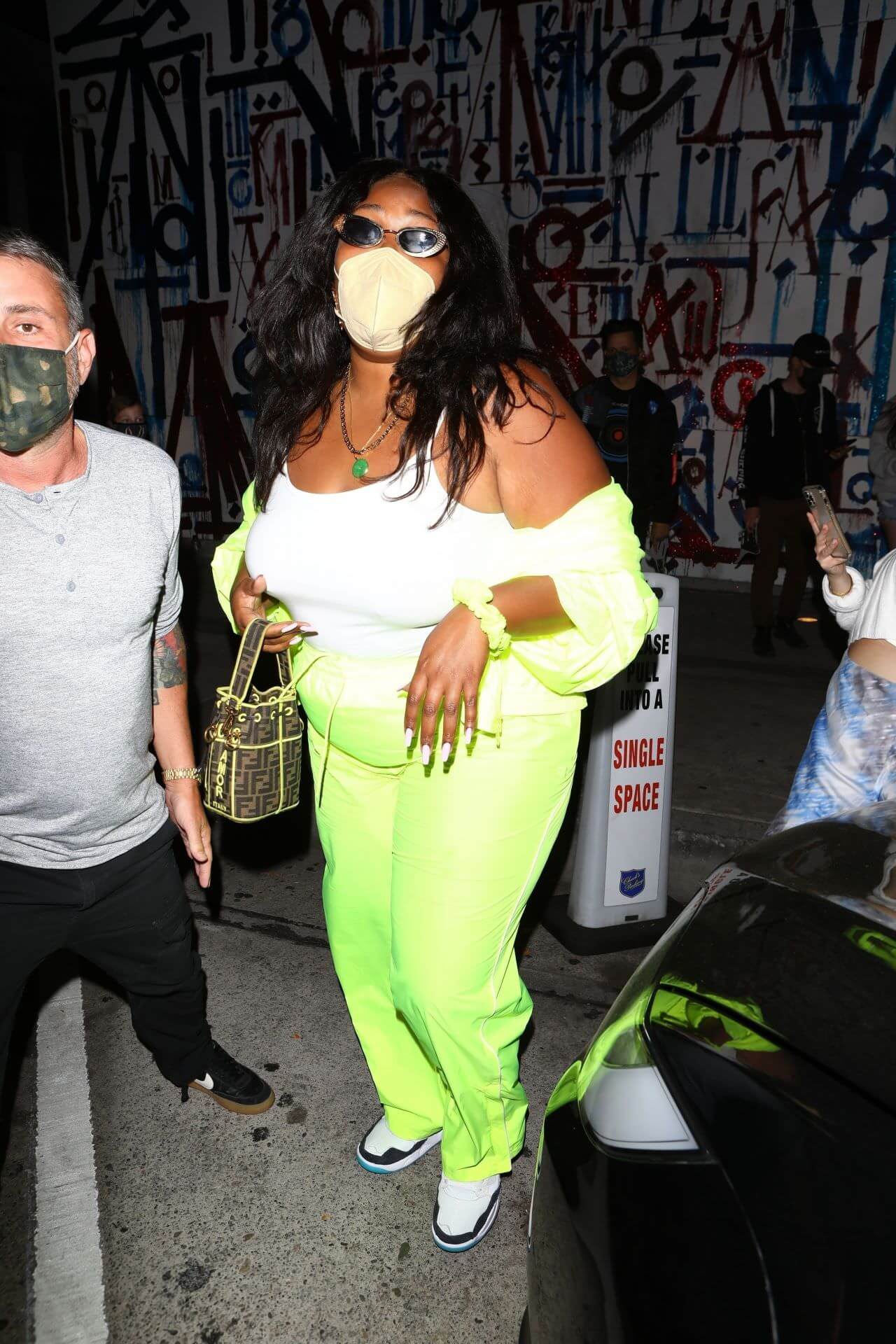 lizzo in neon green outfit at craig s in west hollywood 3