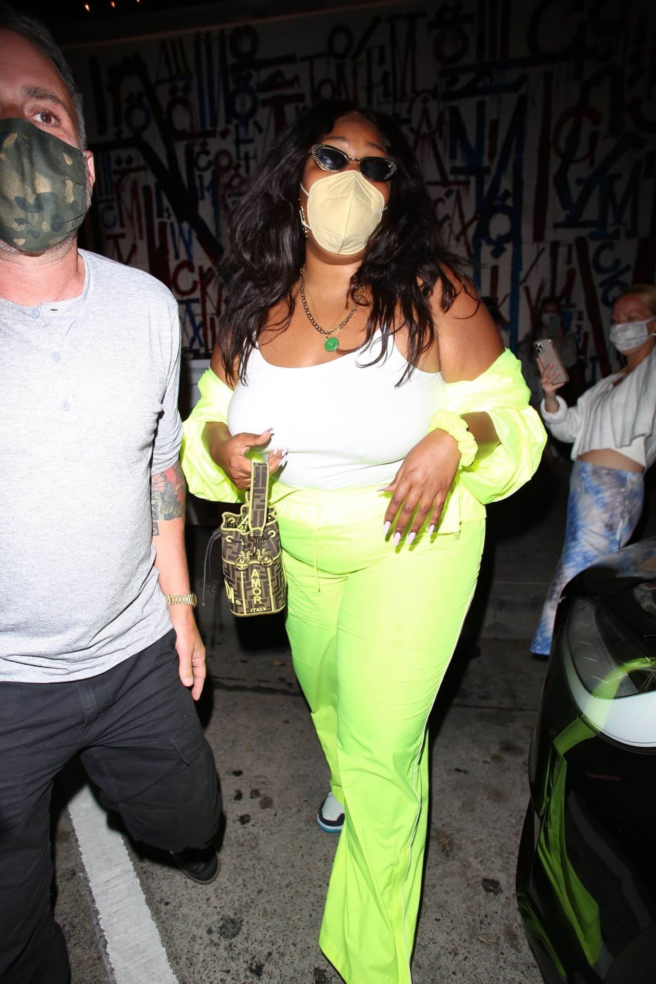 lizzo in neon green outfit at craig s in west hollywood 4