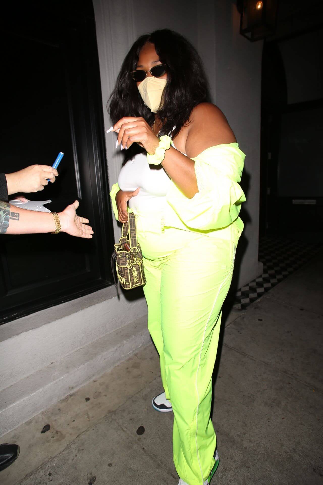 lizzo in neon green outfit at craig s in west hollywood 5