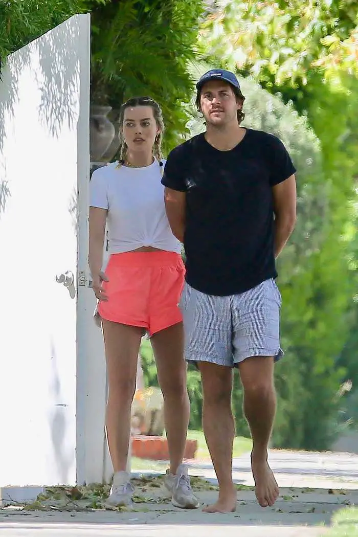 margot robbie in pink running shorts steps out with her husband 1