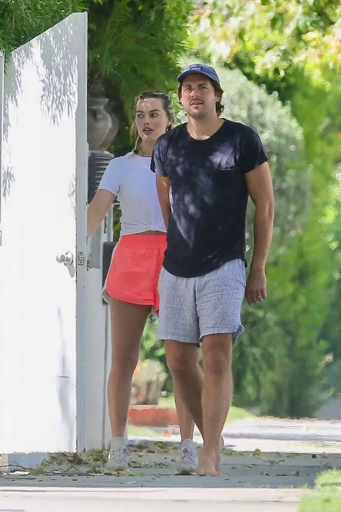 margot robbie in pink running shorts steps out with her husband 2