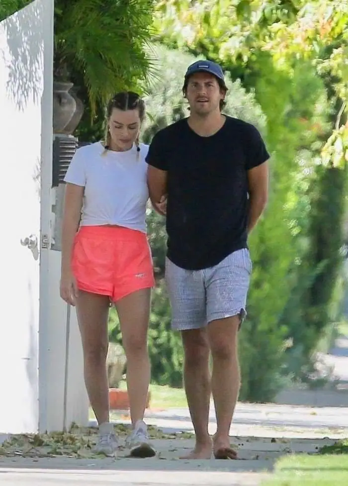 margot robbie in pink running shorts steps out with her husband 4