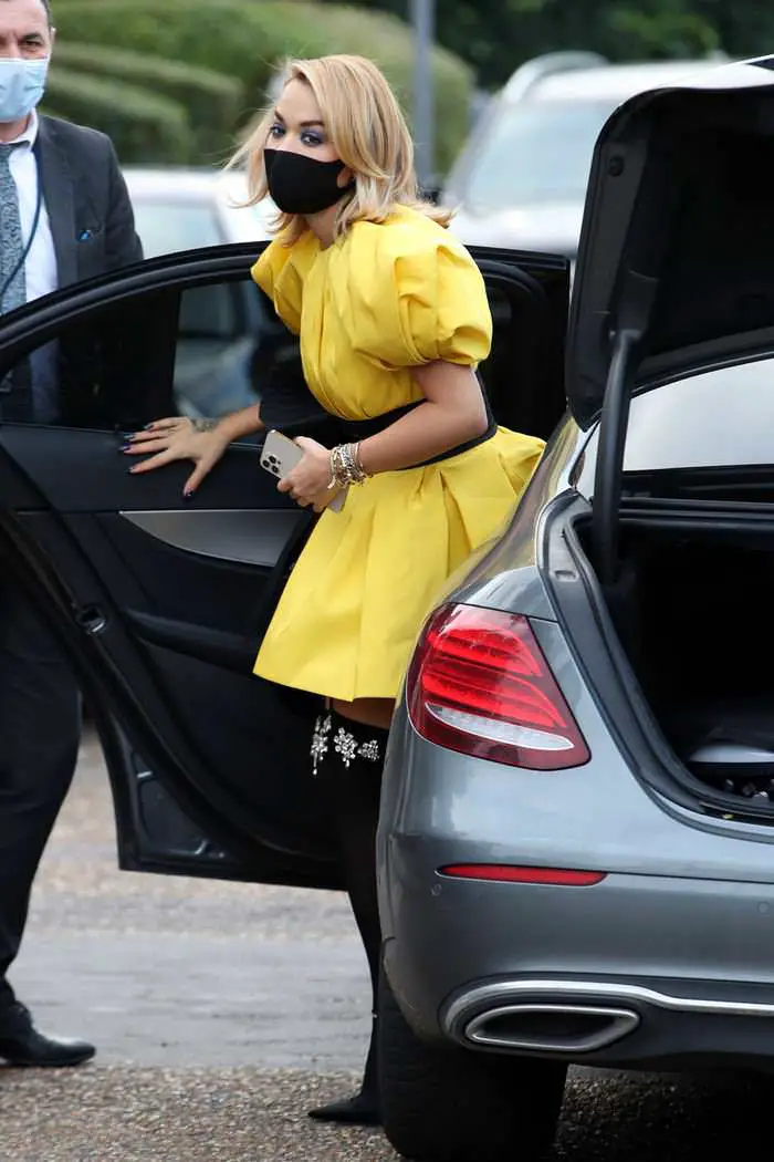 rita ora in a puffy bright yellow mini dress out in london 1