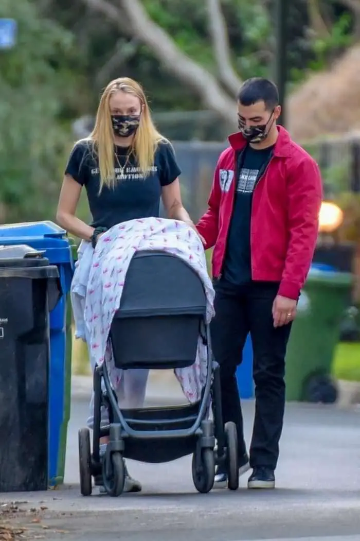 sophie turner and joe jonas walk with their baby girl around their neighborhood 4
